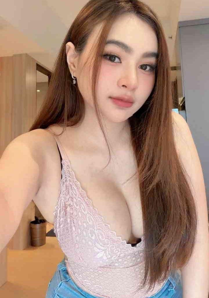 KL Escort Girl Young woman with long brown hair and a pink lace top Escort Malay